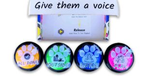 Woof Meow Hello recordable buttons for dogs, with colorful box that reads "give them a voice" on front flap.