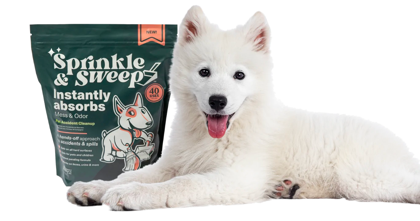 Cute white dog to the right of a bag of Sprinkle & Sweep.