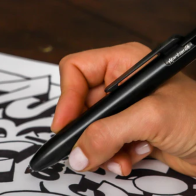 The MARKSMITH Black Ti Bolt Action Pen being used.