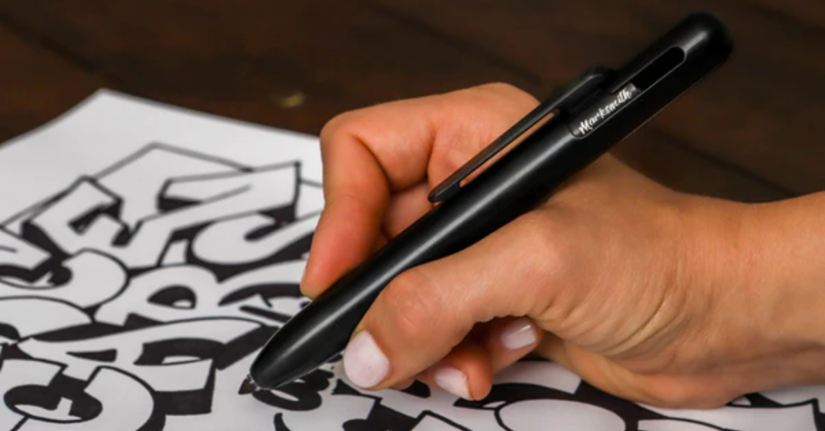The MARKSMITH Black Ti Bolt Action Pen being used to draw.