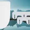 The Nebia Bidet against a blue background.