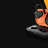The Skullcandy Push Active True Wireless Earbuds in a black and orange color.