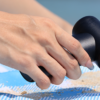 The Augmotor Anymotor being used to blow away sand off a towel.