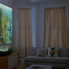 The Philips Screeneo U5 4K Projector being used by two people.