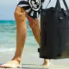 The LEVANTE Waterproof Modular Daily Backpack being carried on the beach.