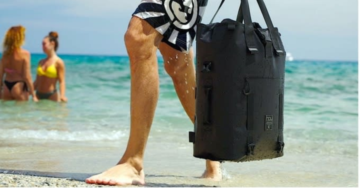 The LEVANTE Waterproof Modular Daily Backpack being carried on the beach.