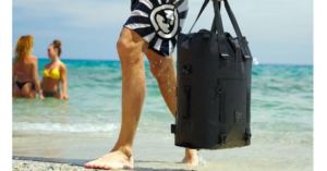 The Levante Waterproof Modular Backpack being carried on a beach.